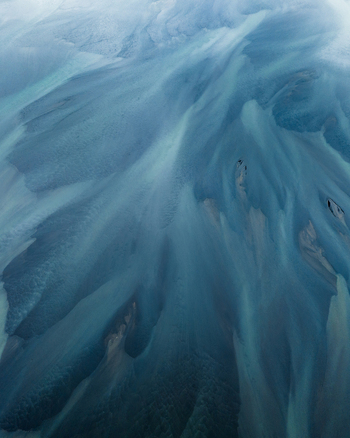 Aerial view of glacial rivers intertwine in mesmerizing patterns painting the landscape with shades of turquoise and gray Iceland Iceland. Aerial view of glacial rivers intertwine in mesmerizing patterns painting the landscape with shades of turquoise and gray Iceland Iceland.