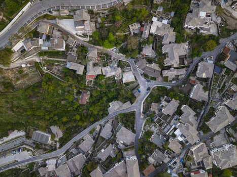 Aerial view of the historic stone architecture and winding streets of the old town in Gjirokaster Gjirokaster County Albania. Aerial view of the historic stone architecture and winding streets of the old town in Gjirokaster Gjirokaster County Albania.