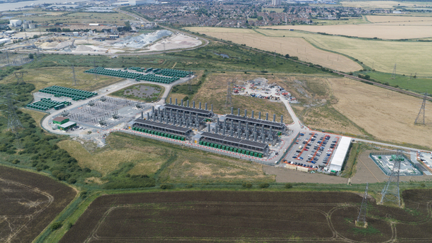 Aerial view of Thurrock Flexible Generation Substation with power generation units battery storage containers and electrical infrastructure in Tilbury England United Kingdom.