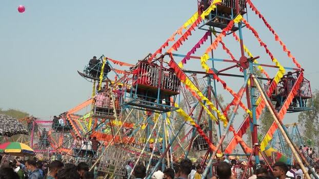 View of a traditional Ferris wheel at a fair in Bogura Bangladesh. View of a traditional Ferris wheel at a fair in Bogura Bangladesh.