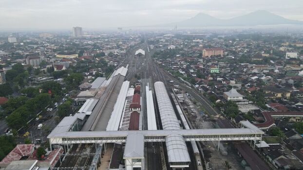 Aerial view of Stasiun Solo Balapan with its railway tracks platforms and surrounding urban landscape in Banjarsari Central Java Indonesia. Aerial view of Stasiun Solo Balapan with its railway tracks platforms and surrounding urban landscape in Banjarsari Central Java Indonesia.