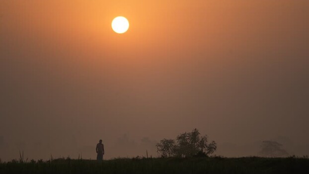 View of a person silhouette at sunrise in Bangladesh.