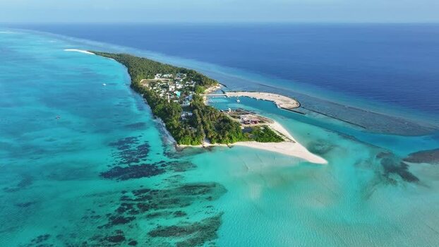 Aerial view of Fulhadhoo island with turquoise lagoons Maldives. Aerial view of Fulhadhoo island with turquoise lagoons Maldives.