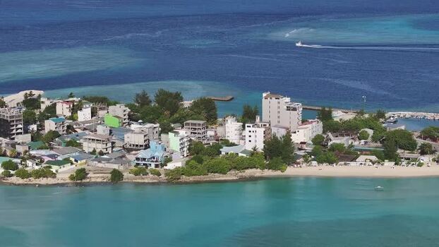Aerial view of Gulhi island buildings and turquoise waters Maldives. Aerial view of Gulhi island buildings and turquoise waters Maldives.
