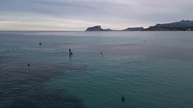 Aerial view of paddleboarder in the sea near Moraira Spain.