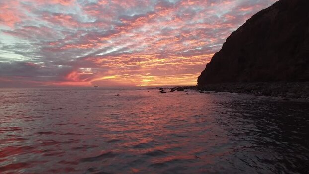 View of a vibrant sunset over the ocean United States. View of a vibrant sunset over the ocean United States.