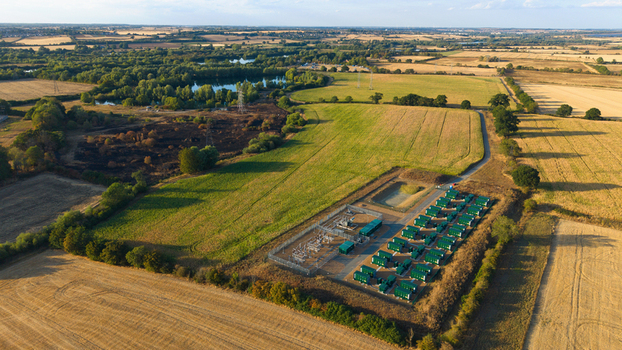 Aerial view of Battery Energy park BESS Grendon featuring rows of green battery storage units and electrical infrastructure in Northampton England United Kingdom. Aerial view of Battery Energy park BESS Grendon featuring rows of green battery storage units and electrical infrastructure in Northampton England United Kingdom.