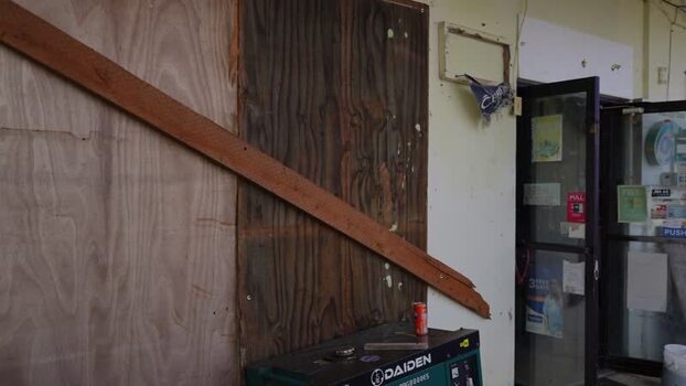 View of a boarded up storefront in San Jose Northern Mariana Islands. View of a boarded up storefront in San Jose Northern Mariana Islands.