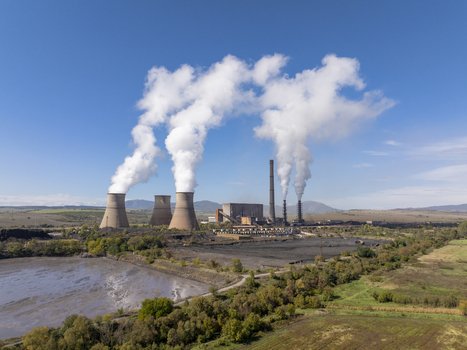 Aerial view of the Bobov Dol Power Plant with its iconic cooling towers emitting white smoke set against a rural landscape in Golemo Selo Kyustendil Province Bulgaria. Aerial view of the Bobov Dol Power Plant with its iconic cooling towers emitting white smoke set against a rural landscape in Golemo Selo Kyustendil Province Bulgaria.