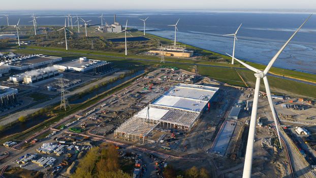 Eemshaven Netherlands 21 April 2026 Aerial view of the Google GRQ data center construction site surrounded by wind turbines and industrial infrastructure near the coast. Eemshaven Netherlands 21 April 2026 Aerial view of the Google GRQ data center construction site surrounded by wind turbines and industrial infrastructure near the coast.