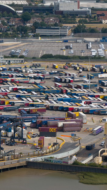 Purfleet on Thames England United Kingdom 10 July 2026 Aerial view of the Purfleet Container terminal featuring rows of shipping containers parked trucks and industrial infrastructure along the River Thames.
