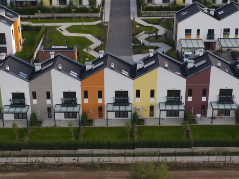 Aerial view of the modern Residential Park Lozen complex featuring colorful townhouses with gabled roofs private gardens and paved walkways in Sofia Sofia City Province Bulgaria. Aerial view of the modern Residential Park Lozen complex featuring colorful townhouses with gabled roofs private gardens and paved walkways in Sofia Sofia City Province Bulgaria.