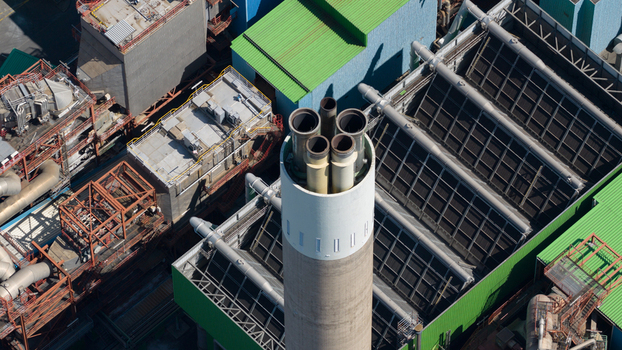 Aerial view of the Abfallkraftwerk Herten waste to energy plant with complex industrial piping chimneys and metal structures Herten Nordrhein Westfalen Germany.