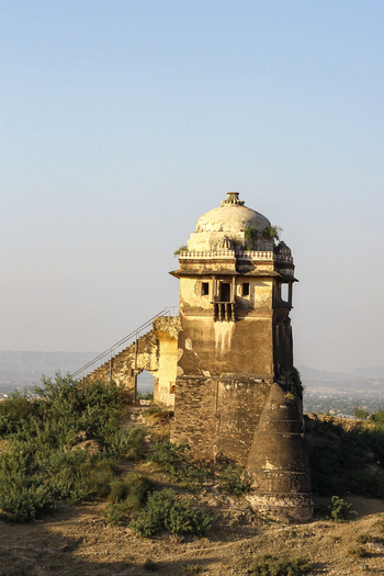 View of the historic Rohtas Fort watchtower with its stone dome and exterior staircase set against a clear sky in Dina Punjab Pakistan. View of the historic Rohtas Fort watchtower with its stone dome and exterior staircase set against a clear sky in Dina Punjab Pakistan.