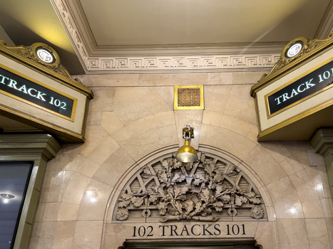 New York United States 14 May 2026 View of the ornate architectural details and track signs at Grand Central Terminal with stone carvings and gold lamps. New York United States 14 May 2026 View of the ornate architectural details and track signs at Grand Central Terminal with stone carvings and gold lamps.