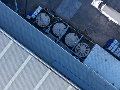 Melbourne VIC Australia 22 September 2026 Aerial view of industrial facility in Kilsyth with circular storage tanks and a truck in the loading area. Melbourne VIC Australia 22 September 2026 Aerial view of industrial facility in Kilsyth with circular storage tanks and a truck in the loading area.