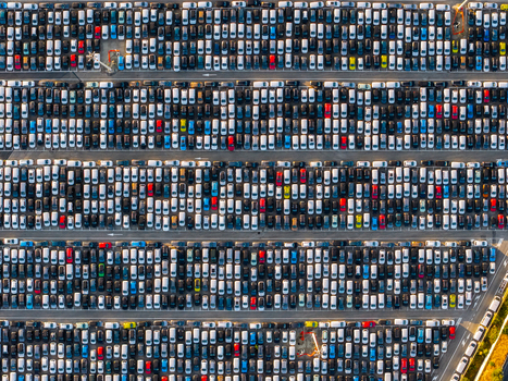 Aerial view of rows of new cars parked at the Civitavecchia Port automotive terminal in Civitavecchia Lazio Italy. Aerial view of rows of new cars parked at the Civitavecchia Port automotive terminal in Civitavecchia Lazio Italy.