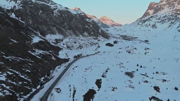 Aerial view of Julierpass road cutting through snow Switzerland. Aerial view of Julierpass road cutting through snow Switzerland.