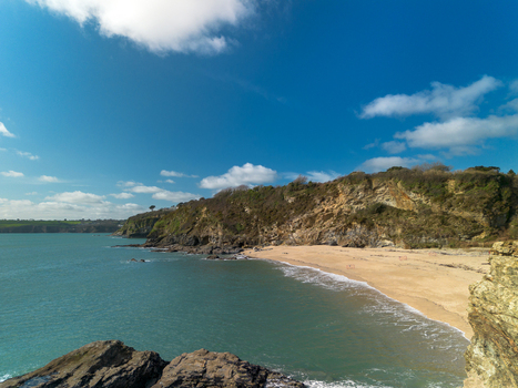 Aerial view of the sandy beach and rugged coastline at Carlyon Bay Cornwall United Kingdom. Aerial view of the sandy beach and rugged coastline at Carlyon Bay Cornwall United Kingdom.