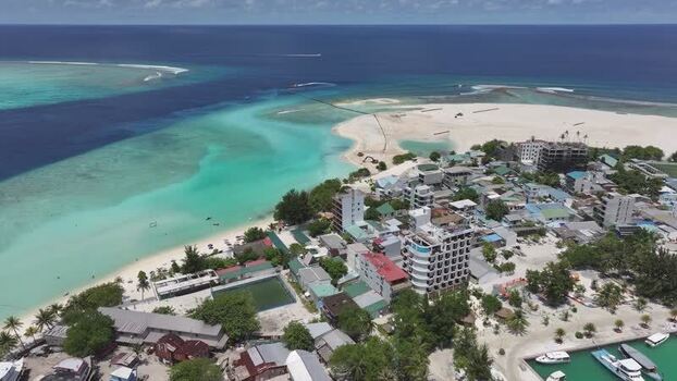 Aerial view of Gulhi island and turquoise ocean waters Maldives Aerial view of Gulhi island and turquoise ocean waters Maldives