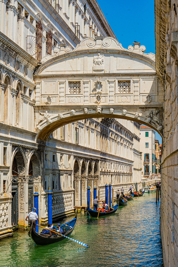 Venice Italy 29 March 2026 View of the Bridge of Sighs a vision in pale stone arches gracefully over the canal as gondolas glide on emerald waters below. Venice Italy 29 March 2026 View of the Bridge of Sighs a vision in pale stone arches gracefully over the canal as gondolas glide on emerald waters below.