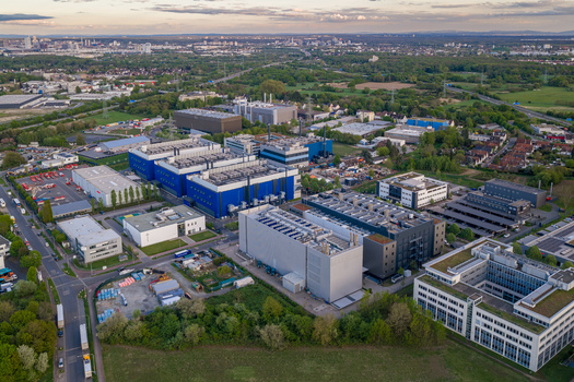 Aerial view of the Digital Realty Frankfurt FRA30 data center complex with modern industrial buildings and cooling systems in Frankfurt am Main Hessen Germany. Aerial view of the Digital Realty Frankfurt FRA30 data center complex with modern industrial buildings and cooling systems in Frankfurt am Main Hessen Germany.