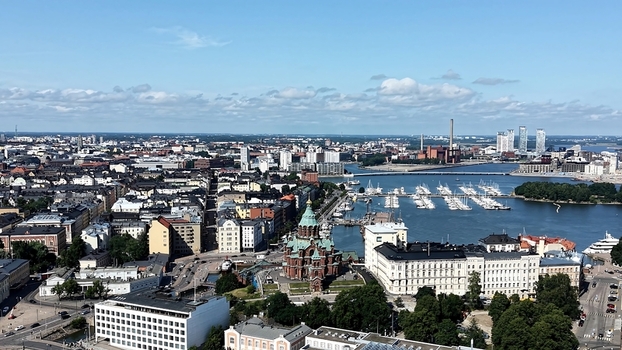 Aerial view of Uspenski Cathedral surrounded by the historic cityscape harbor and marina in Helsinki Uusimaa Finland. Aerial view of Uspenski Cathedral surrounded by the historic cityscape harbor and marina in Helsinki Uusimaa Finland.