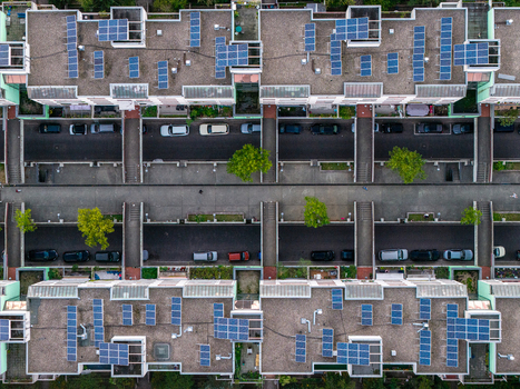 Aerial view of High Deck Siedlung residential complex featuring solar panels on rooftops pedestrian bridges connecting buildings and parked cars on the streets in Berlin Berlin Germany. Aerial view of High Deck Siedlung residential complex featuring solar panels on rooftops pedestrian bridges connecting buildings and parked cars on the streets in Berlin Berlin Germany.