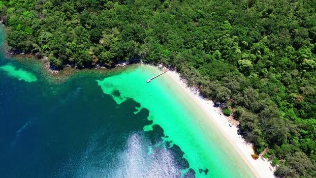 Aerial view of a tropical beach and lush forest in Guanaja Honduras. Aerial view of a tropical beach and lush forest in Guanaja Honduras.