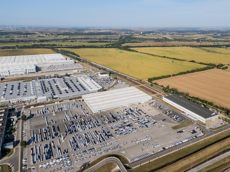 Aerial view of the Volkswagen Slovakia plant in Devinska Nova Ves with industrial warehouses and vast parking lots filled with new cars in Bratislava Bratislavsky kraj Slovakia. Aerial view of the Volkswagen Slovakia plant in Devinska Nova Ves with industrial warehouses and vast parking lots filled with new cars in Bratislava Bratislavsky kraj Slovakia.