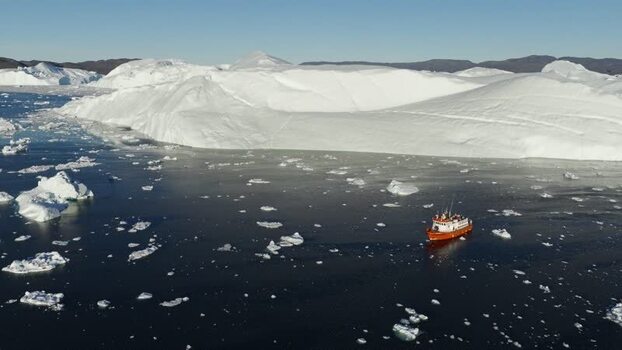 Aerial view of Ilulissat glacier with a boat Greenland.