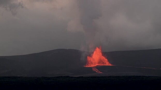 View of a volcanic eruption with glowing lava United States.