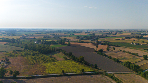 Aerial view of the Po River landscape during a summer heatwave with low water levels exposing dry riverbeds and agricultural fields in Castelvetro Piacentino Emilia Romagna Italy. Aerial view of the Po River landscape during a summer heatwave with low water levels exposing dry riverbeds and agricultural fields in Castelvetro Piacentino Emilia Romagna Italy.