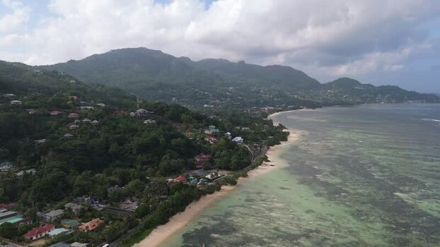 Aerial view of Mahe coastline and lush green hills Seychelles.