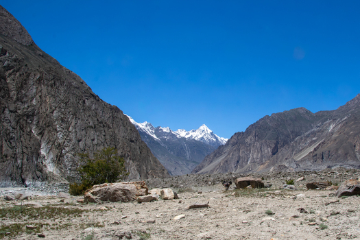 View of the rugged terrain and snow capped peaks of the Karakoram range near K2 Base Camp Ghakhar Gilgit Pakistan. View of the rugged terrain and snow capped peaks of the Karakoram range near K2 Base Camp Ghakhar Gilgit Pakistan.