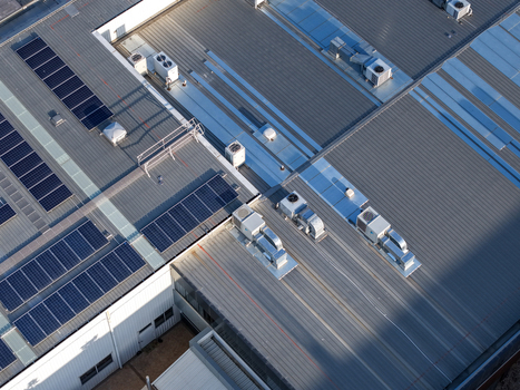 Kilsyth VIC Australia 22 September 2026 Aerial view of industrial factory rooftops featuring solar panels and ventilation units under bright daylight. Kilsyth VIC Australia 22 September 2026 Aerial view of industrial factory rooftops featuring solar panels and ventilation units under bright daylight.