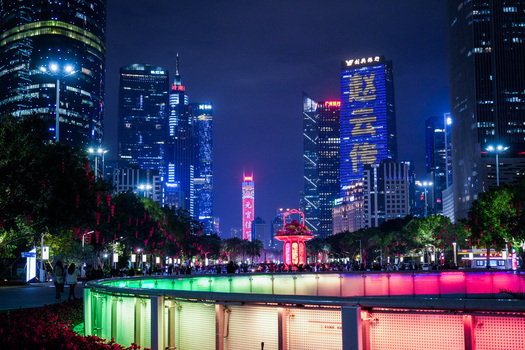 Guangzhou Guangdong Province China 23 February 2024 View of the illuminated skyline at night with vibrant neon lights modern skyscrapers and a glowing circular structure. Guangzhou Guangdong Province China 23 February 2024 View of the illuminated skyline at night with vibrant neon lights modern skyscrapers and a glowing circular structure.