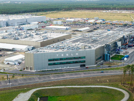 Grunheide Mark Brandenburg Germany 07 September 2026 Aerial view of the Tesla Gigafactory Berlin Brandenburg featuring modern industrial buildings rooftop solar arrays and surrounding forest. Grunheide Mark Brandenburg Germany 07 September 2026 Aerial view of the Tesla Gigafactory Berlin Brandenburg featuring modern industrial buildings rooftop solar arrays and surrounding forest.