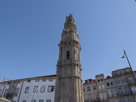 View of the historic Clerigos Tower with its intricate baroque stone architecture rising against a clear blue sky in Porto Porto District Portugal. View of the historic Clerigos Tower with its intricate baroque stone architecture rising against a clear blue sky in Porto Porto District Portugal.