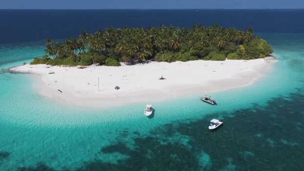 Aerial view of a tropical island with white sand beach Maldives. Aerial view of a tropical island with white sand beach Maldives.