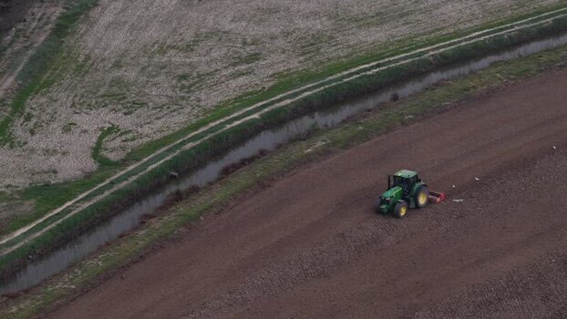 Aerial view of a tractor plowing a field Portugal. Aerial view of a tractor plowing a field Portugal.