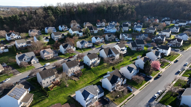Aerial view of the residential neighborhood of Hempfield in Rohrerstown featuring suburban houses green lawns and blooming trees in Rohrerstown Pennsylvania United States.