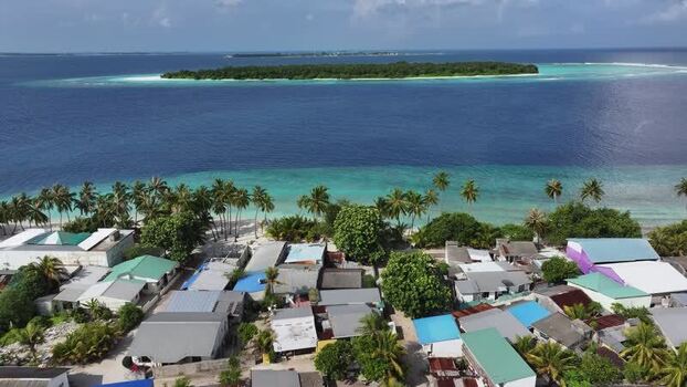 Aerial view of the tropical island village of Maalhos Maldives. Aerial view of the tropical island village of Maalhos Maldives.
