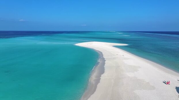 Aerial view of a white sandbar and turquoise ocean in Fulhadhoo Maldives. Aerial view of a white sandbar and turquoise ocean in Fulhadhoo Maldives.