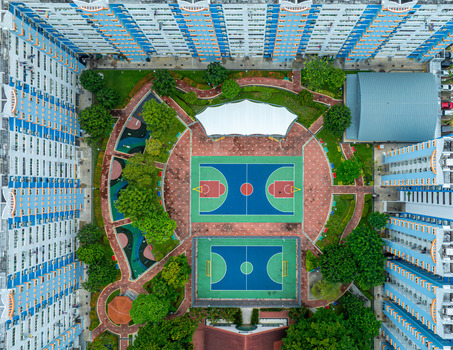 Aerial view of the Boon Keng HDB public housing complex featuring vibrant basketball and futsal courts surrounded by lush greenery and residential buildings in Singapore Bendemeer Road Singapore. Aerial view of the Boon Keng HDB public housing complex featuring vibrant basketball and futsal courts surrounded by lush greenery and residential buildings in Singapore Bendemeer Road Singapore.