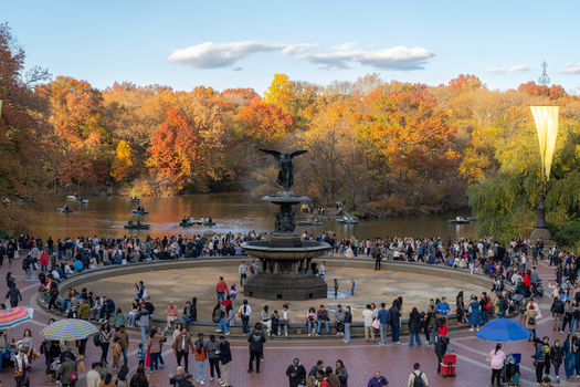 Manhattan United States 08 November 2025 View of Bethesda Fountain in Central Park bustling with people amidst the vibrant autumn foliage and the serene lake. Manhattan United States 08 November 2025 View of Bethesda Fountain in Central Park bustling with people amidst the vibrant autumn foliage and the serene lake.