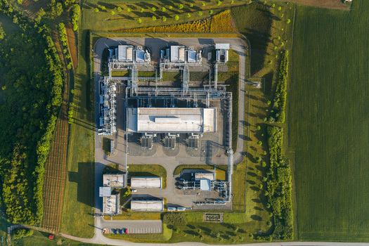 Aerial view of the UGS Damborice industrial facility with complex piping and storage tanks surrounded by green fields and trees in Damborice South Moravian Region Czechia. Aerial view of the UGS Damborice industrial facility with complex piping and storage tanks surrounded by green fields and trees in Damborice South Moravian Region Czechia.