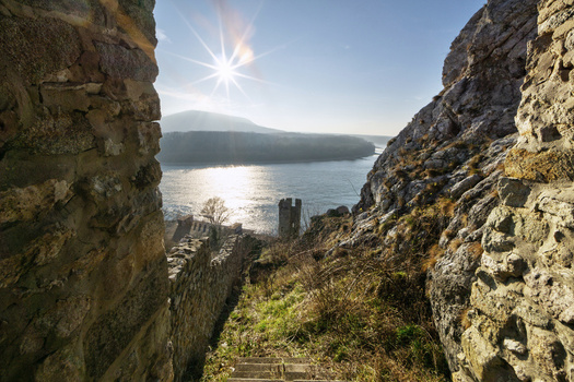 View of Devin Castle ruins overlooking the Danube river under a bright sun in Bratislava IV Bratislava Region Slovakia. View of Devin Castle ruins overlooking the Danube river under a bright sun in Bratislava IV Bratislava Region Slovakia.