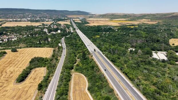 Aerial view of highway through rural fields in Bulgaria.