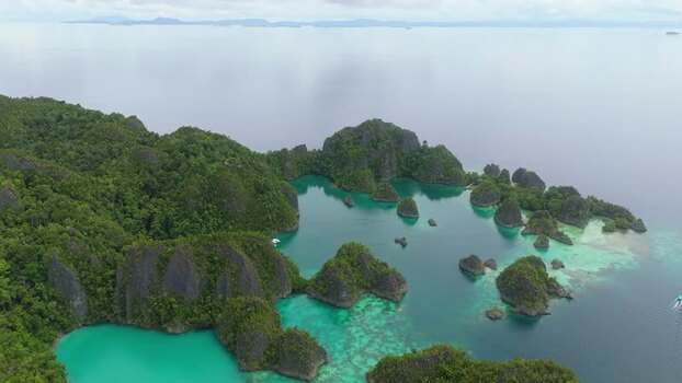 Aerial view of Piaynemo karst islands in turquoise water Indonesia.